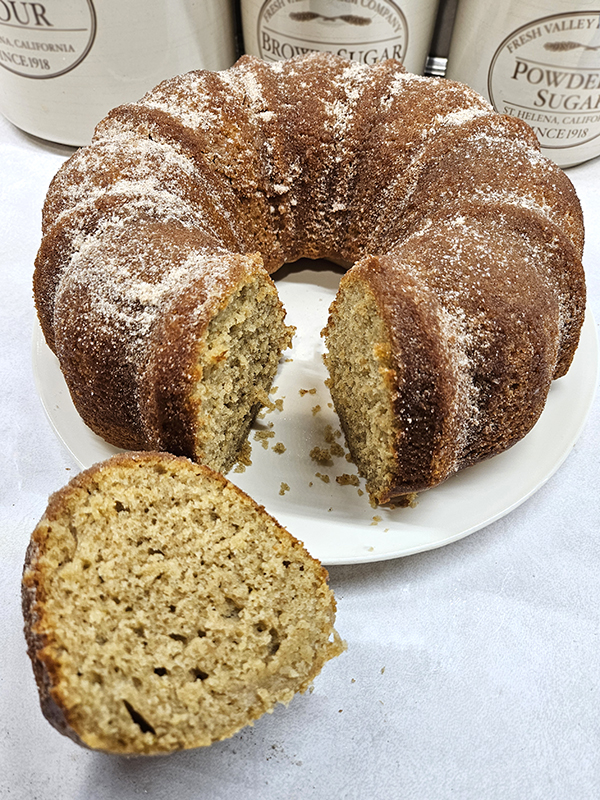 A sliced piece of apple cider doughnut cake
