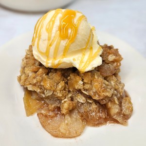 Rustic Apple Crisp with ice cream and caramel drizzle