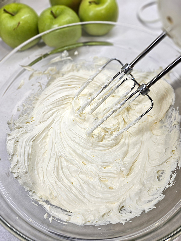 The cool whip and softened cream cheese after mixing - Apple Snicker Salad