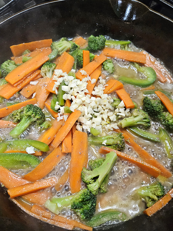 The veggies and garlic being cooked.