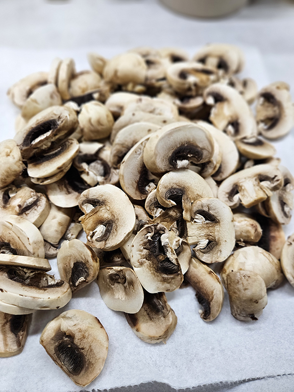 A pile of sliced mushrooms for slow cooker beef stroganoff