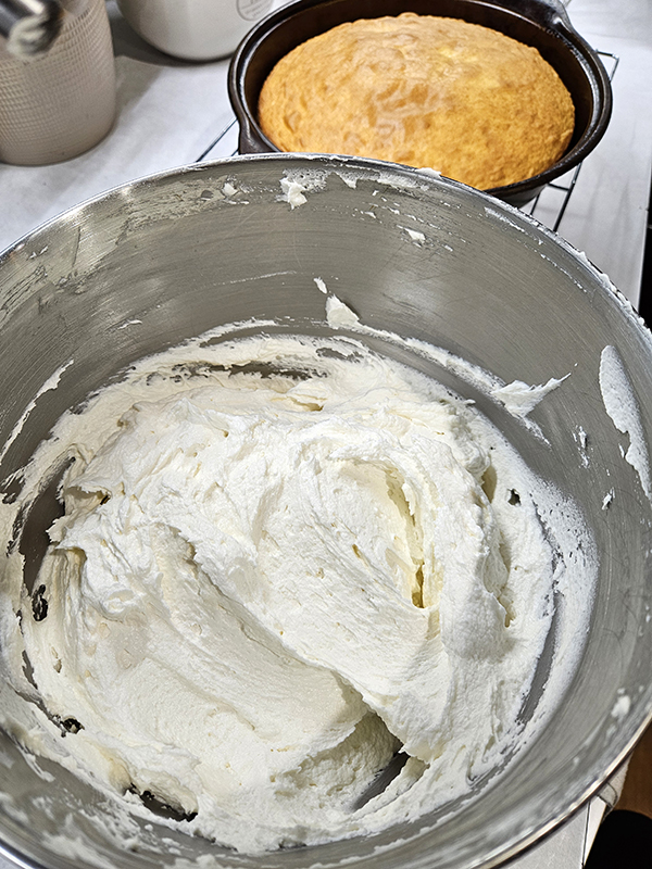 A baked cake ready for frosting with the Bakery Style Buttercream Frosting