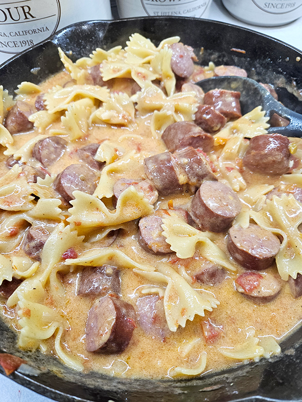 One-Skillet Cheesy bowtie pasta and smoked sausage in a cast iron skillet - Cast iron myths & facts