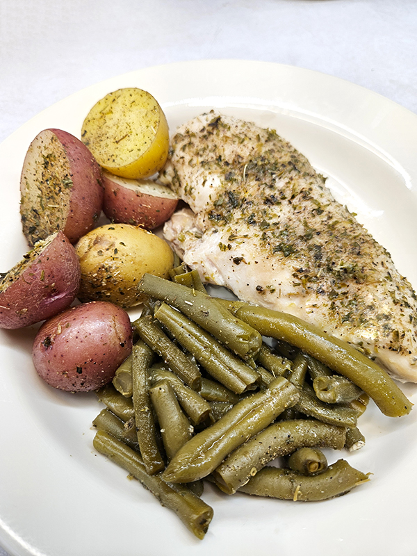 A plated dish of Chicken, Potatoes & Green Beans