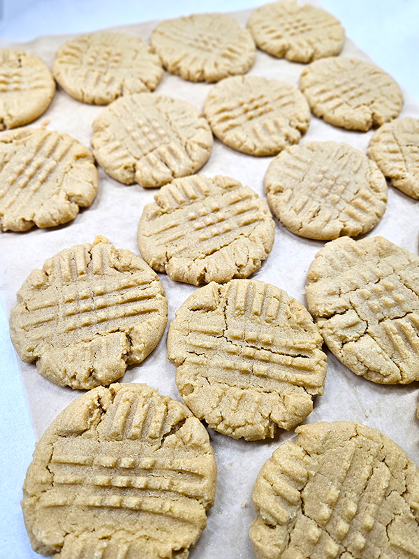 peanut butter cookies on a piece of parchment paper