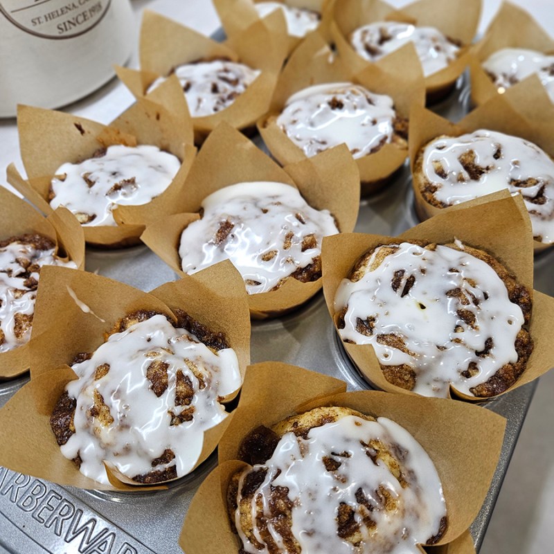 A pan of baked cinnamon roll muffins
