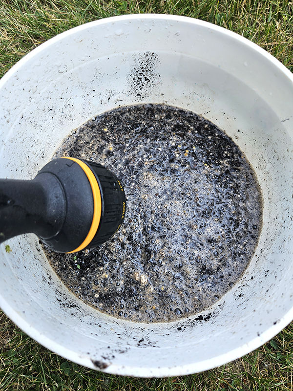 water being added to a bucket