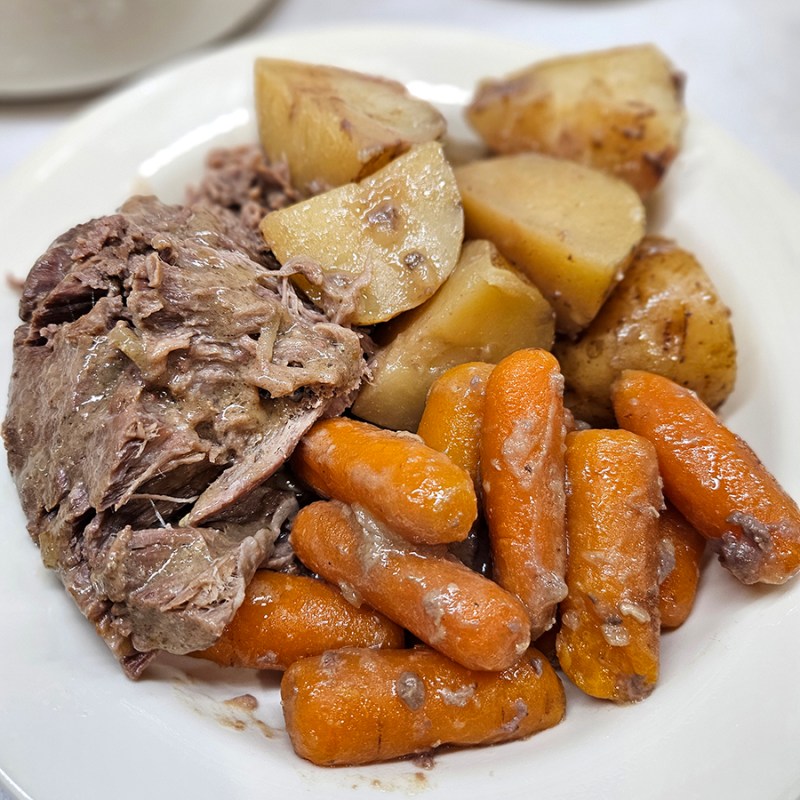 Slow cooker pot roast and veggies with a creamy gravy.