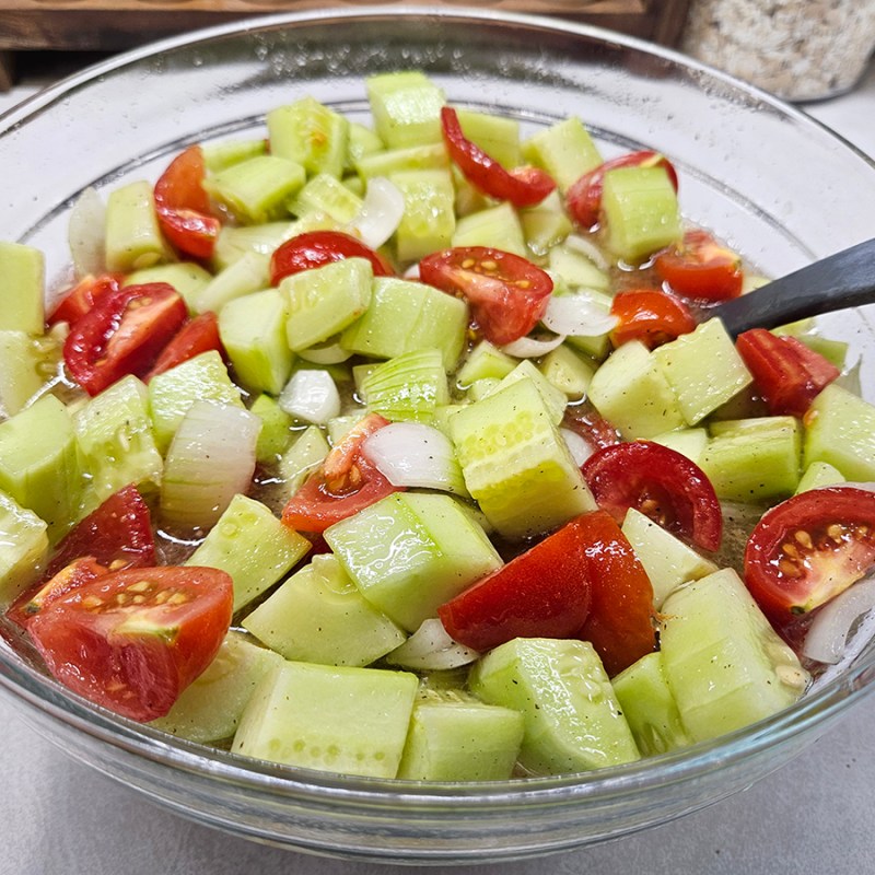 A bowl of Tomato, Cucumber, and Onion Salad