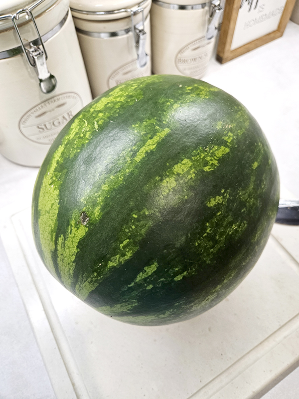 A whole watermelon ready to be easily cut up.