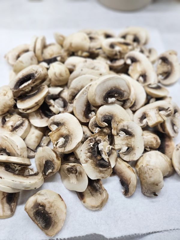 Sliced mushrooms ready to dehydrate