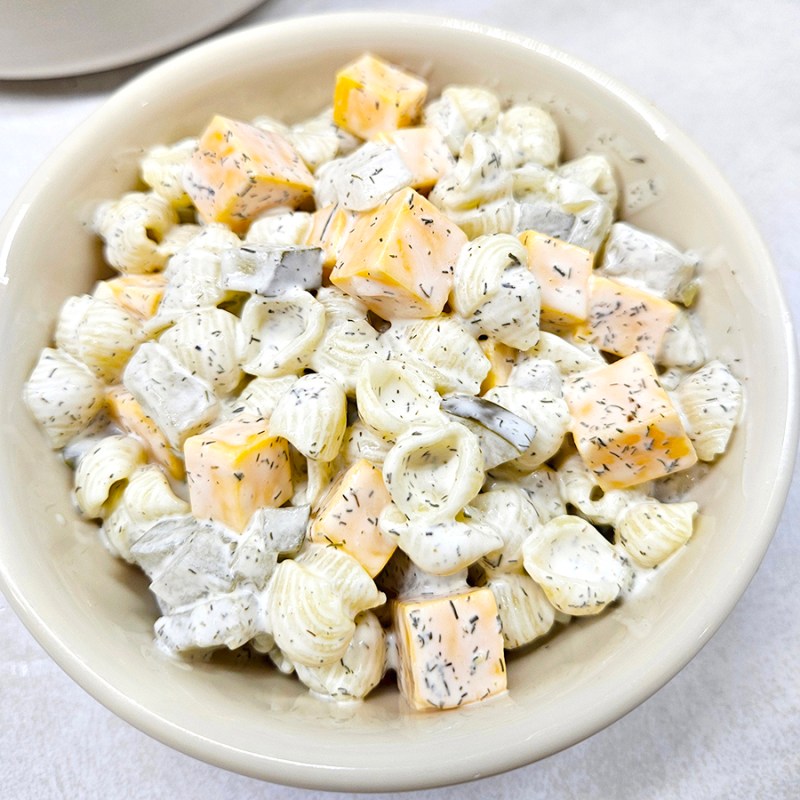 A bowl of dill pickle pasta salad