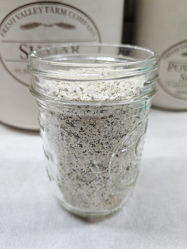 Dry ranch seasoning mix in a half-pint glass jar