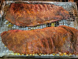 Two racks of ribs coated in homemade dry rub