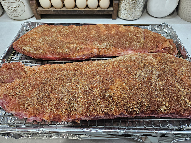 Pork ribs before being oven baked with homemade dry rub coated evenly all over.