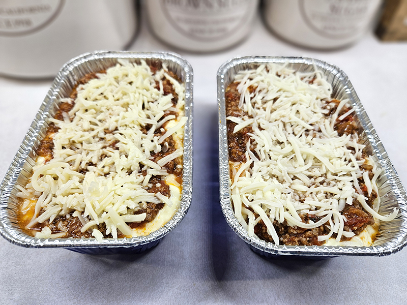Two personal sized lasagnas ready for the freezer