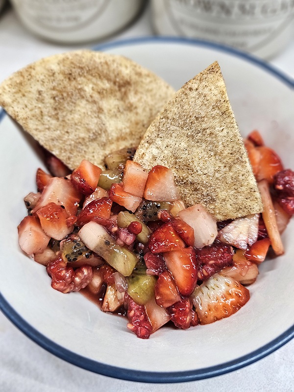 A bowl of refreshing fruit salsa and cinnamon sugar chips