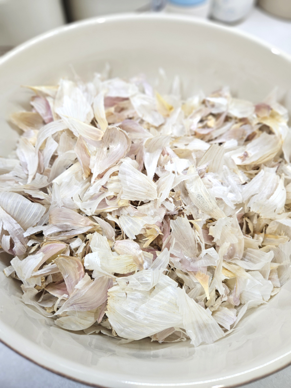 Clean garlic skins in a bowl - Garlic Skin Powder