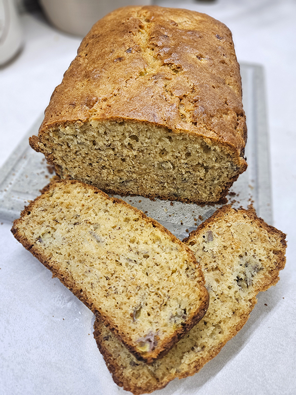 Grandma's Banana Bread Sliced on a cutting board