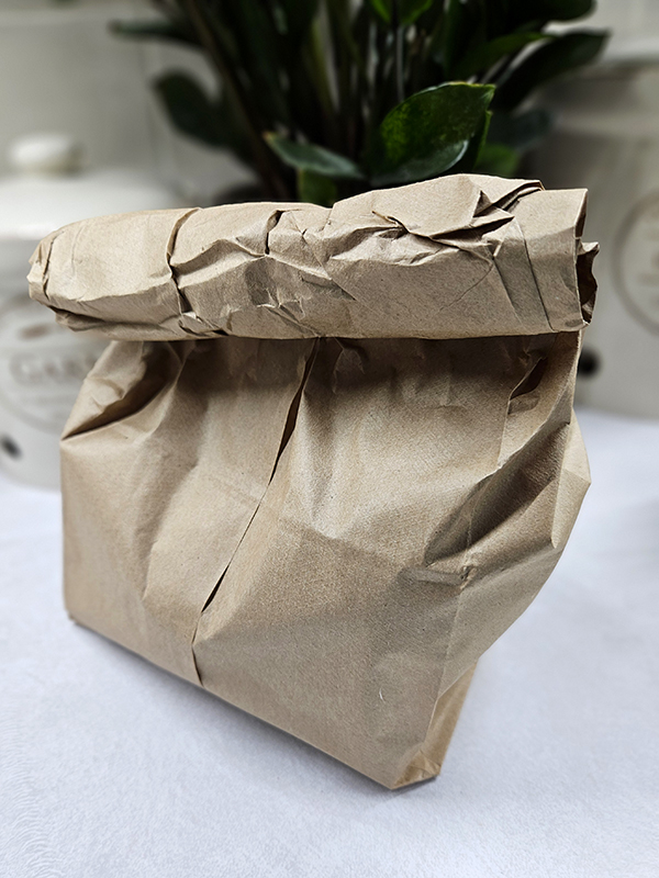 Avocados in a brown paper bag