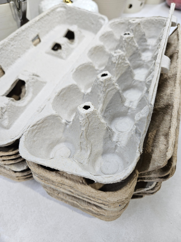 A stack of egg cartons - Everyday Household Items You Can Compost