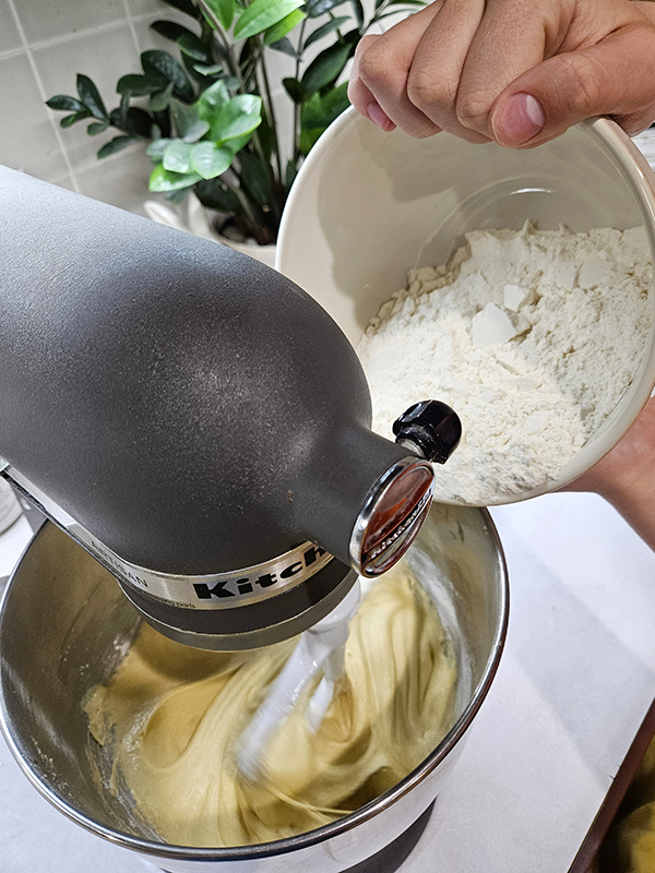 Adding flour to the mixer