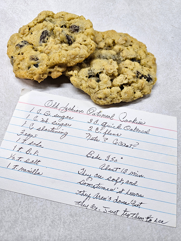 A hand written recipe for old fashion oatmeal raisin cookies