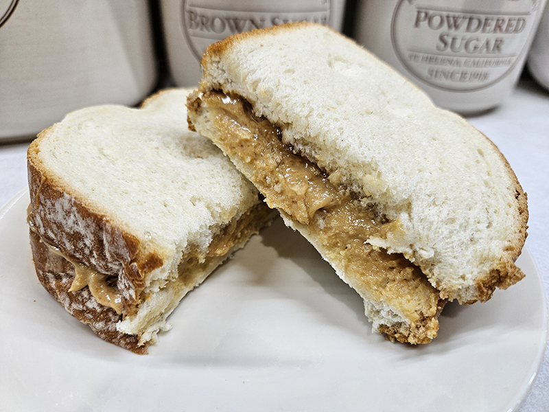 A homemade peanut butter and dandelion jelly sandwich