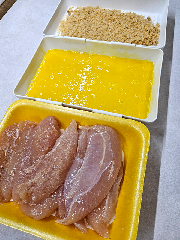 A breading station set up