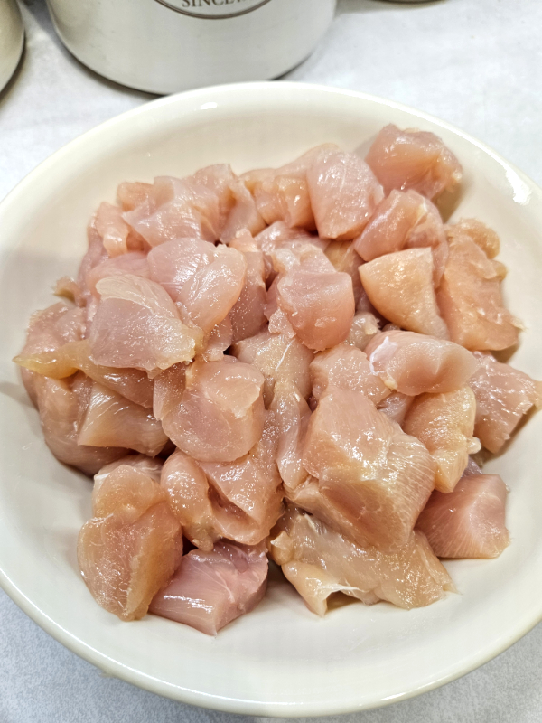 Cut up chicken pieces ready to turn into pork panko nuggets