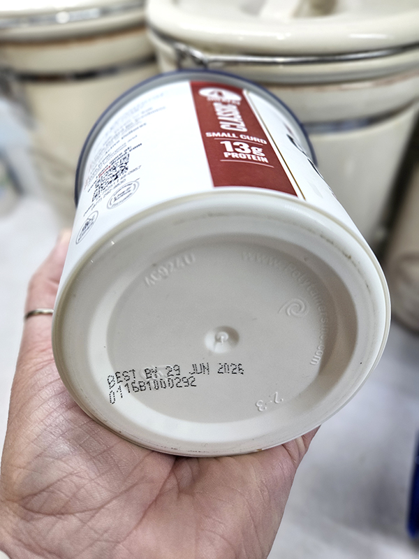 A Best By Date on the bottom of a cottage cheese container - reduce food waste
