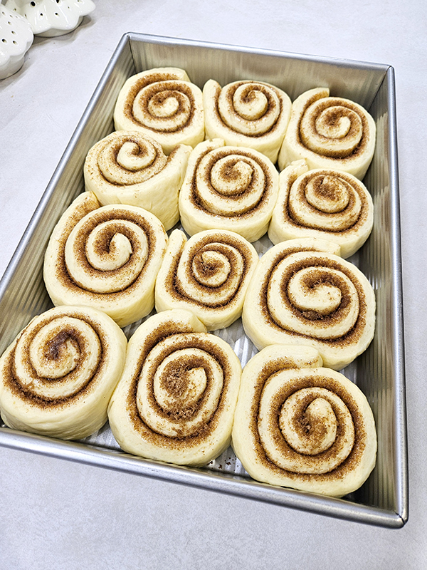 The sweet icing cinnamon rolls after the second proof
