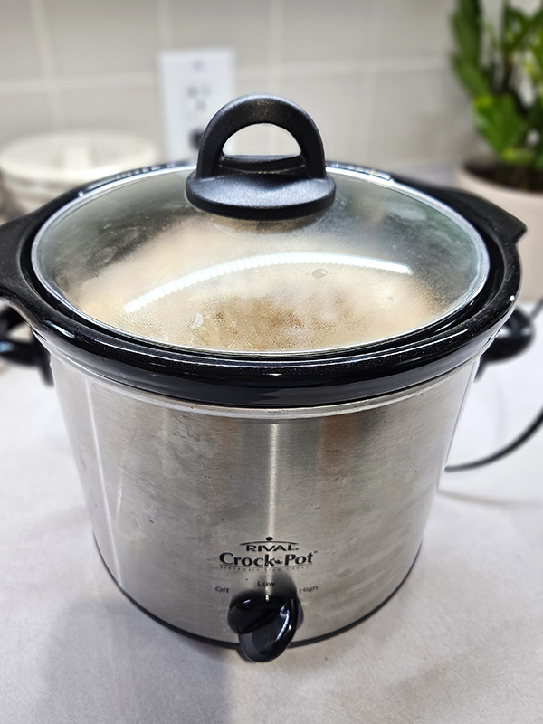 My slow cooker filled with shredded taco salsa chicken