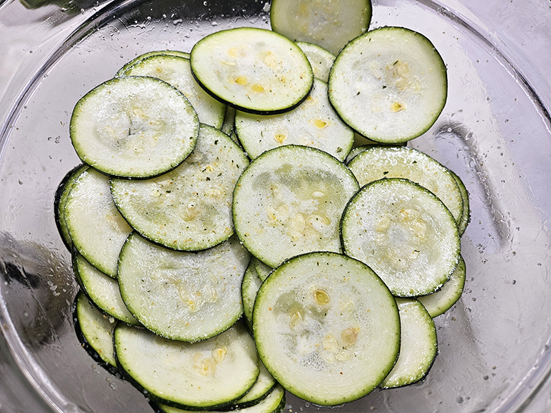 oiled and seasoned zucchini chips before being dehydrated and crispy