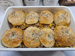A pan of bagel breakfast sliders