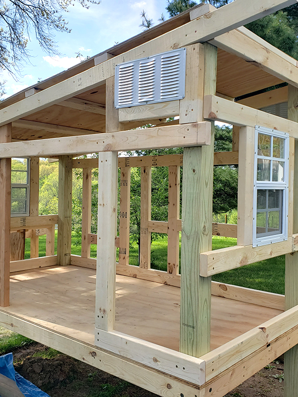 A coop being built showing the vents and a gap at the top 